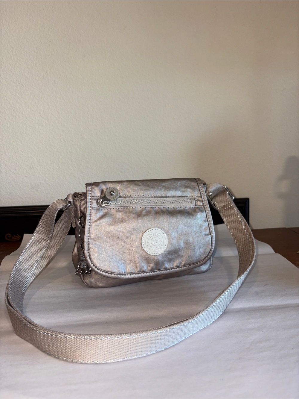 Kipling Metallic Messenger purse with metal gorilla keychain